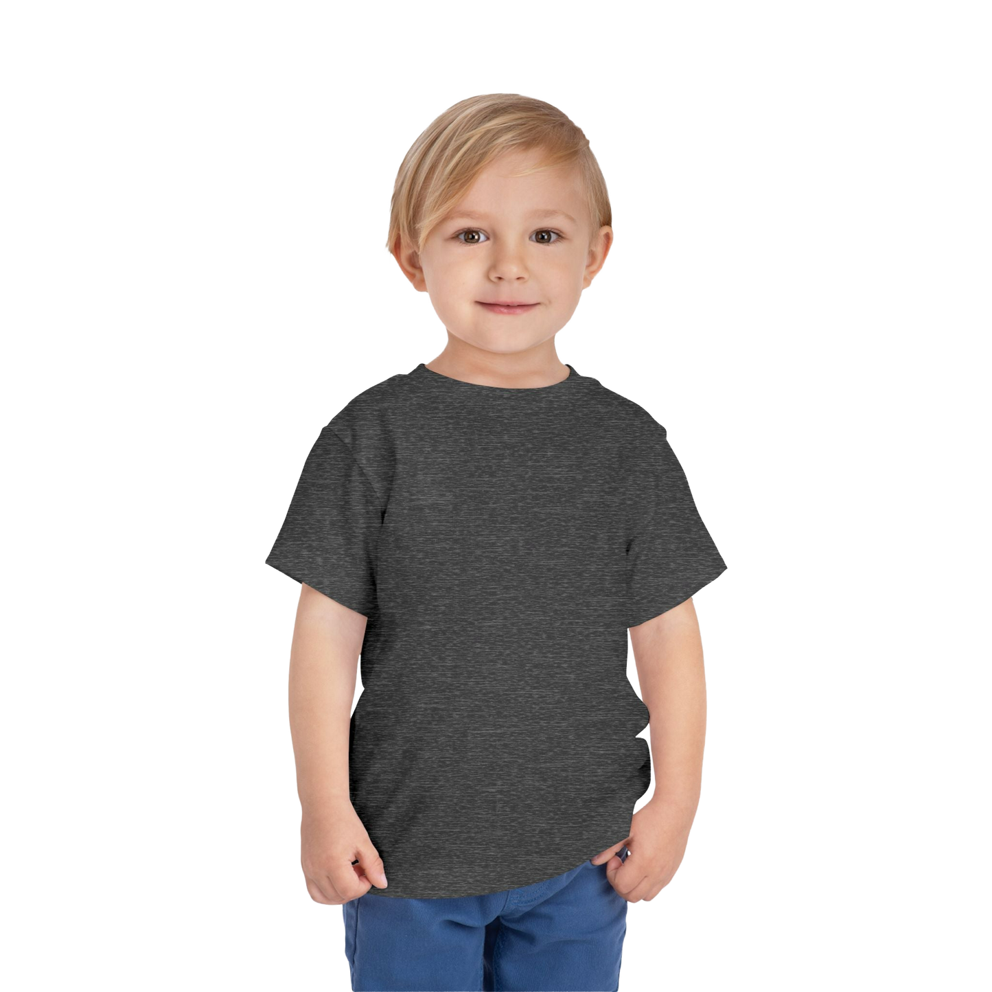 A young boy with blonde hair is standing against a black background, wearing a gray t-shirt and blue pants.