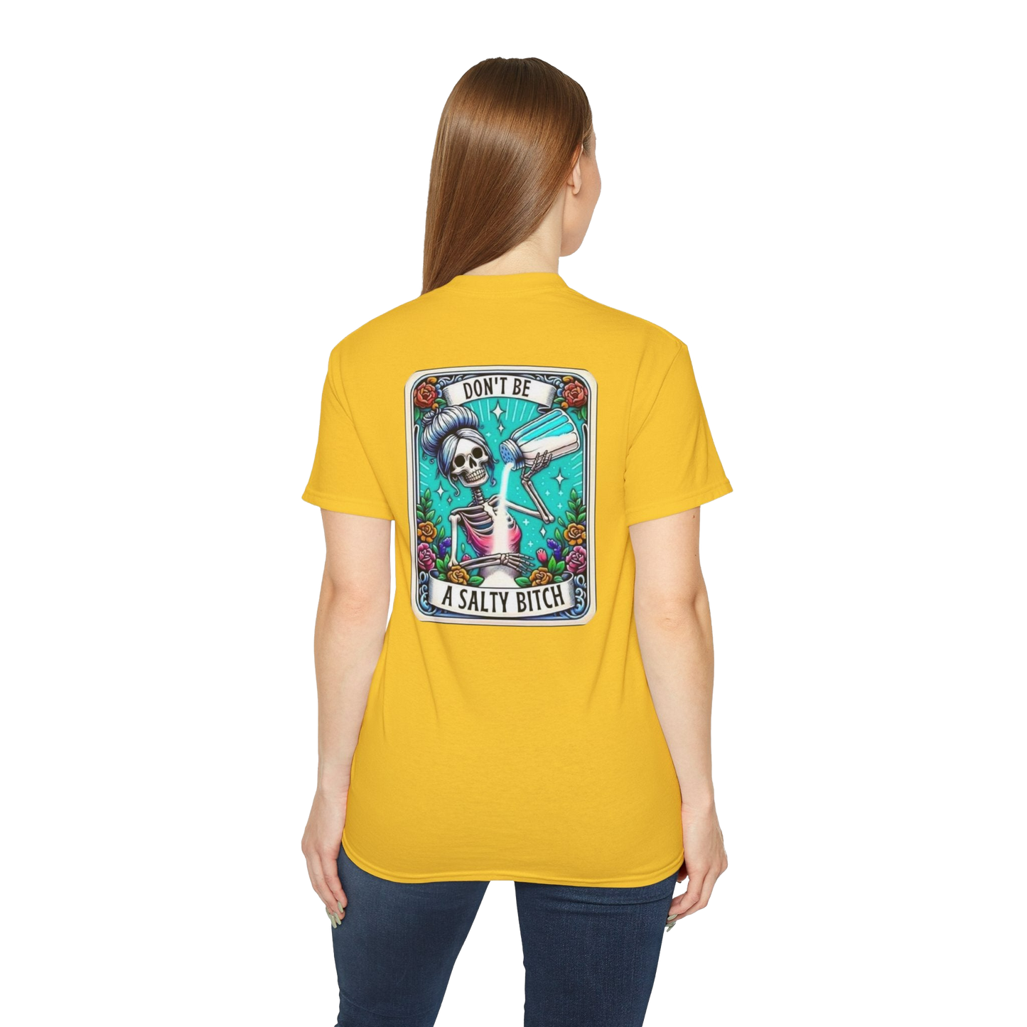 A woman wearing a yellow t-shirt with a graphic design on the back.