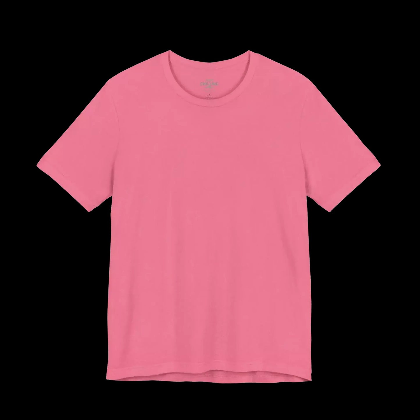 A plain, solid pink t-shirt against a black background.