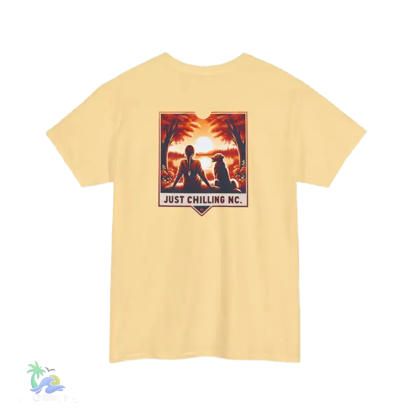 A yellow t-shirt with a graphic design depicting a person sitting in a relaxed pose with a dog, and the text "JUST CHILLING NC" below the image.