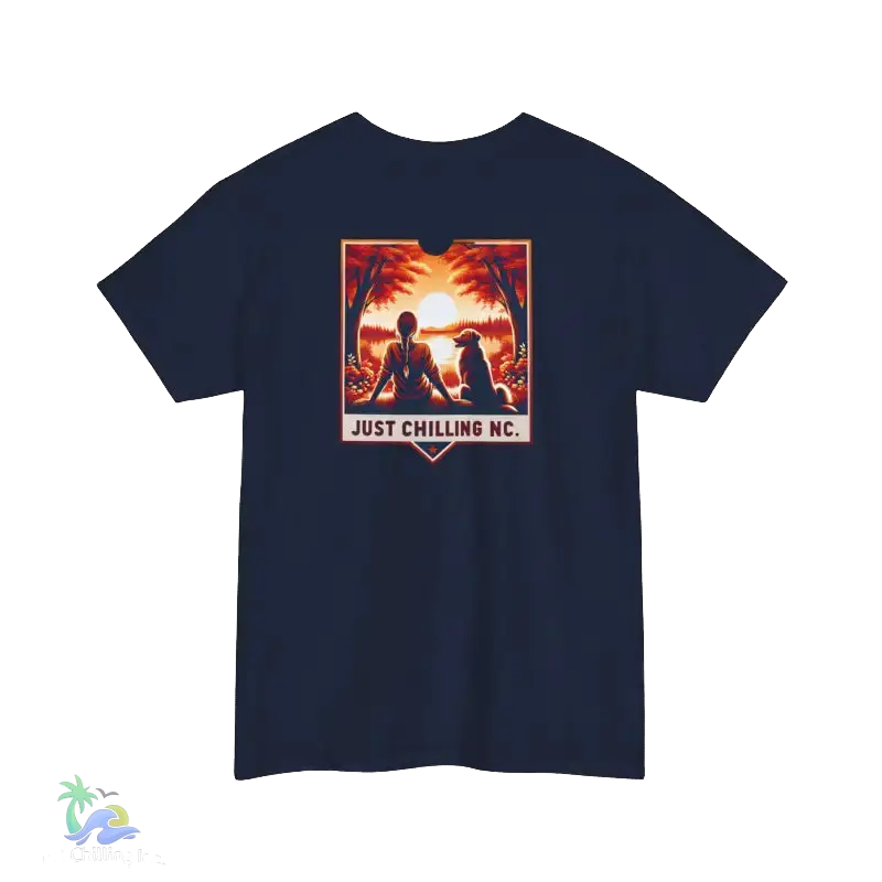 A navy blue t-shirt with a graphic design depicting two silhouetted figures sitting together in a natural setting, with a sunset in the background. The text "JUST CHILLING MC" is displayed below the image.
