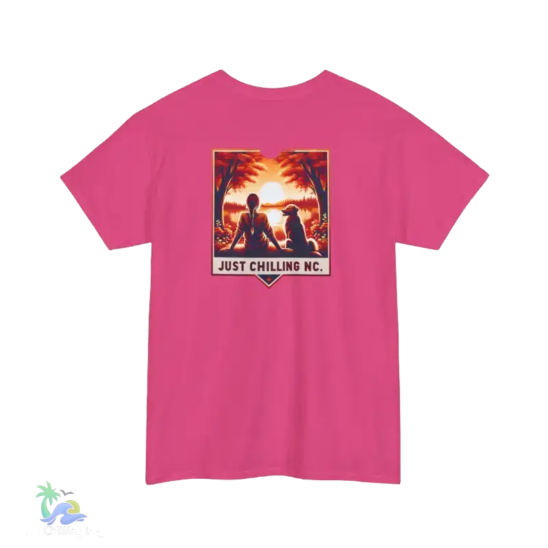 A pink t-shirt with a graphic design featuring a sunset scene with silhouetted figures.
