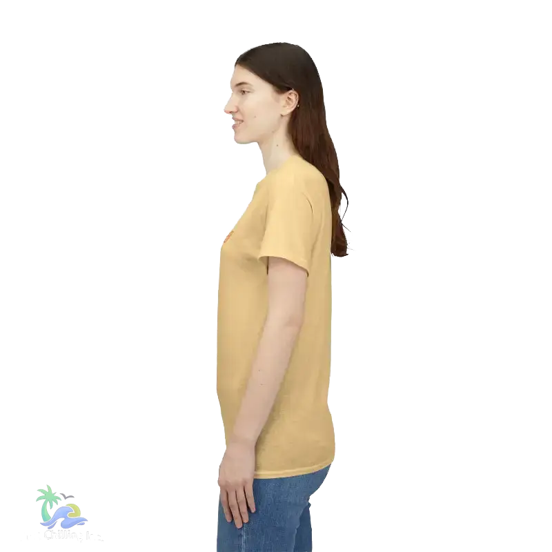 A woman with long brown hair is standing in profile, wearing a yellow t-shirt and blue jeans.