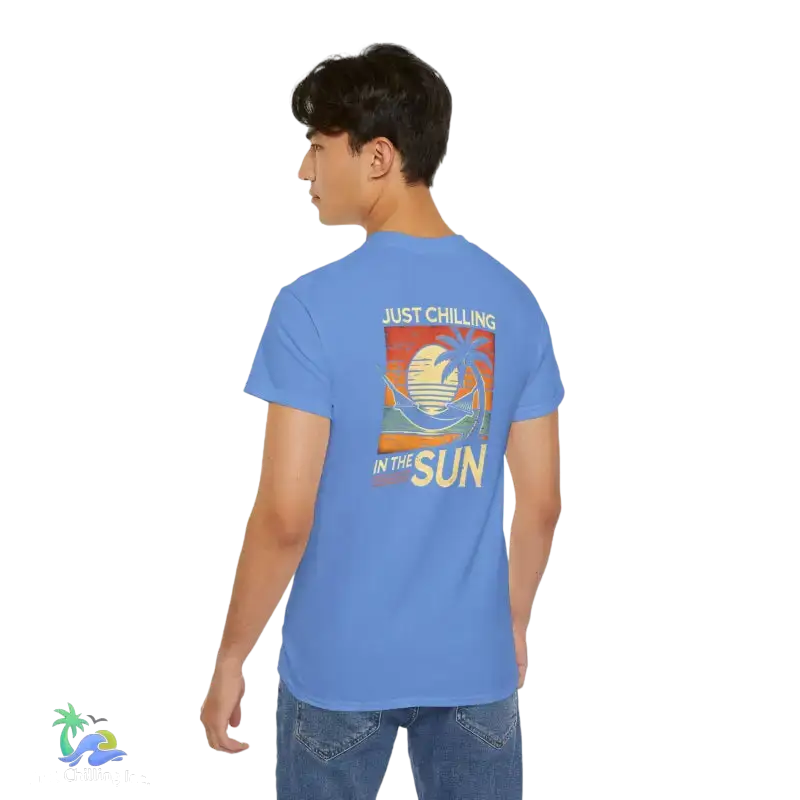Blue t-shirt with beach graphic.