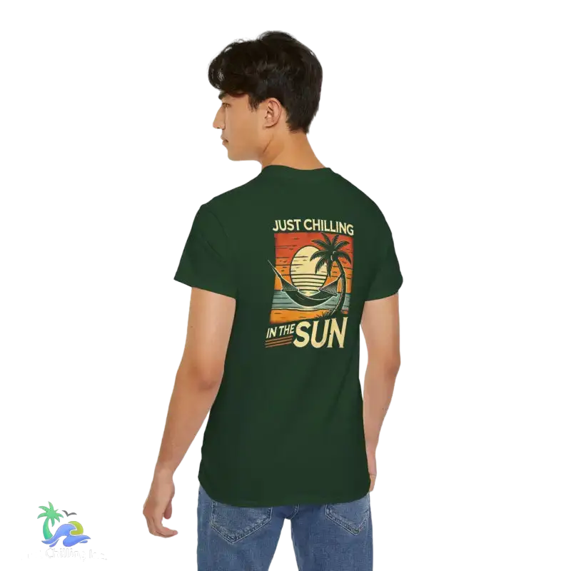 Green t-shirt with beach graphic.