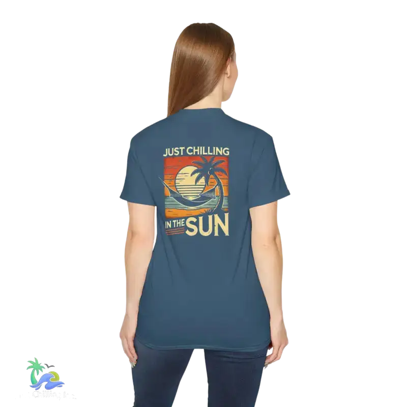 Blue t-shirt with beach graphic.