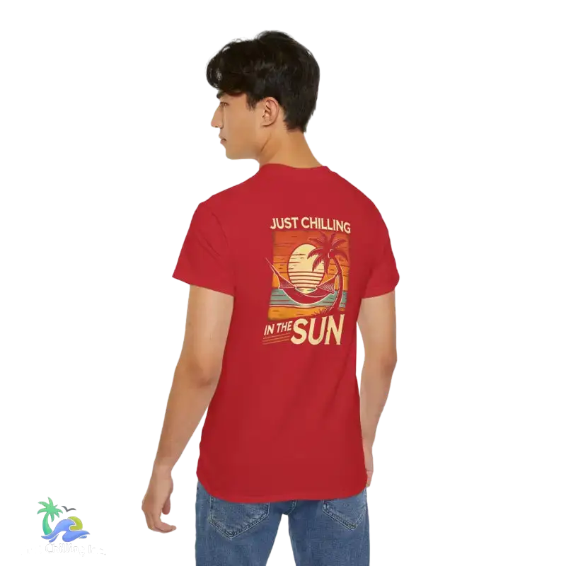 Red t-shirt with beach graphic.