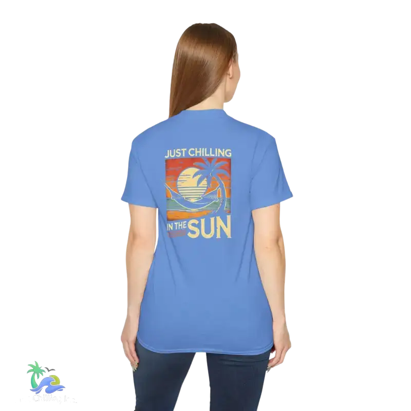 Blue t-shirt with beach graphic.