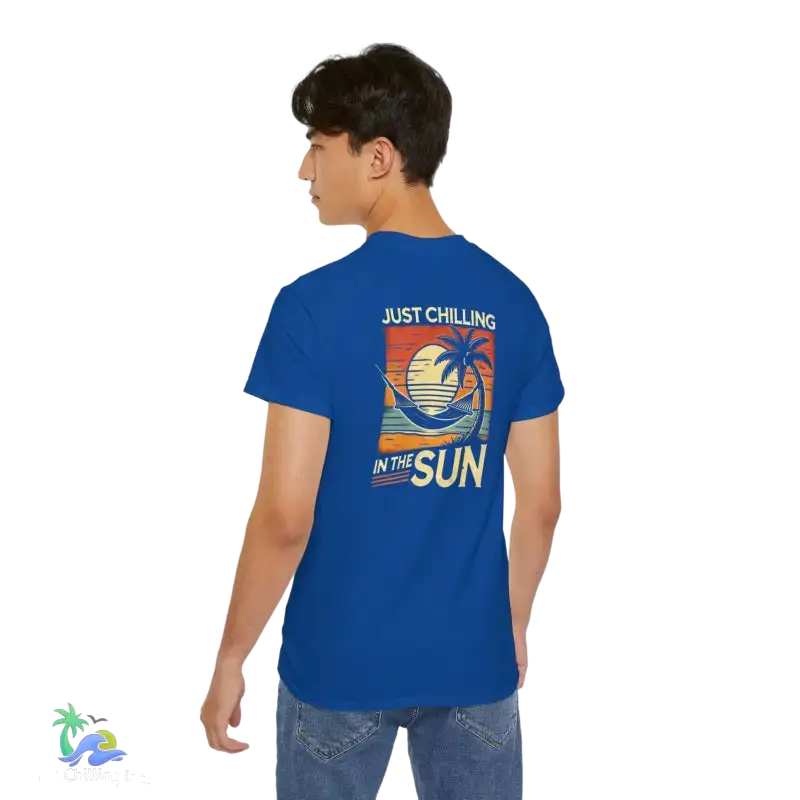 Blue t-shirt with beach graphic.