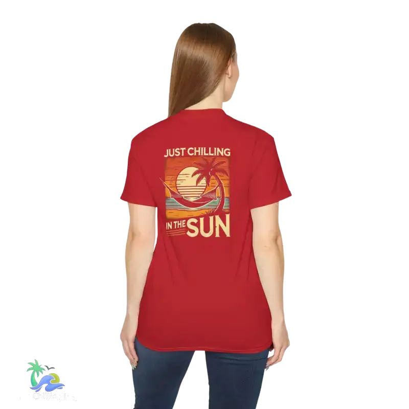 Red t-shirt with beach graphic.
