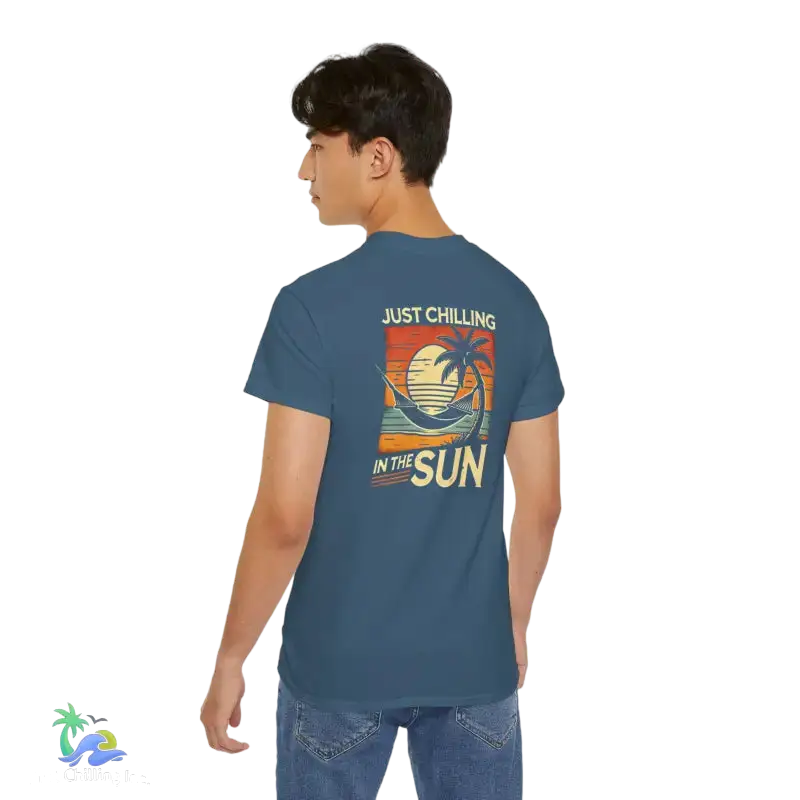 Blue t-shirt with beach graphic.