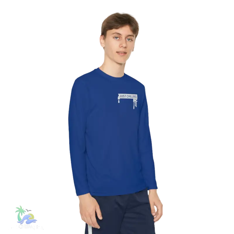 a young man wearing a blue shirt and shorts