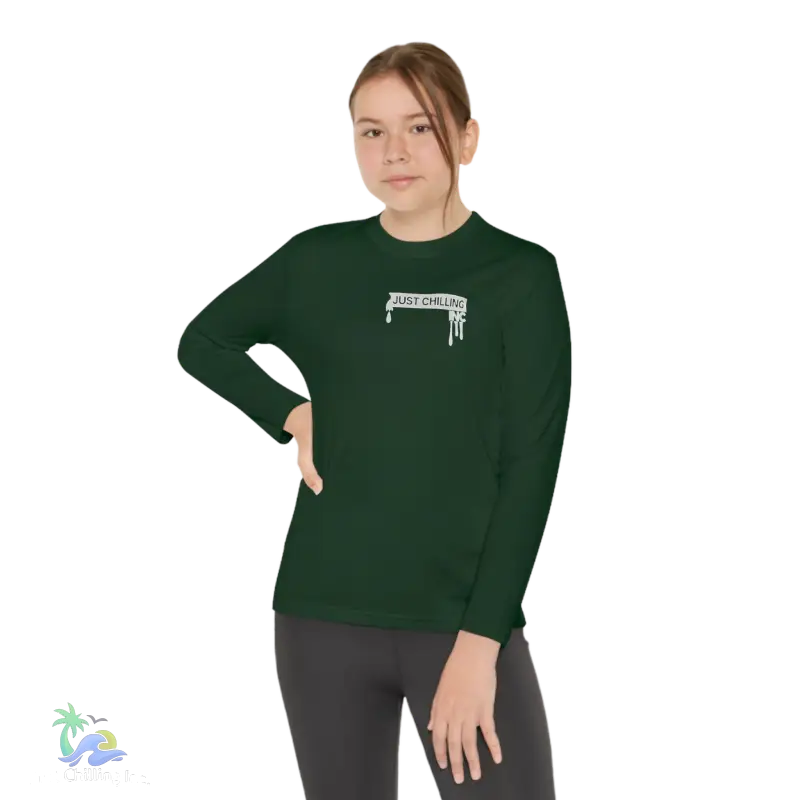 a woman wearing a green shirt with a gun on it