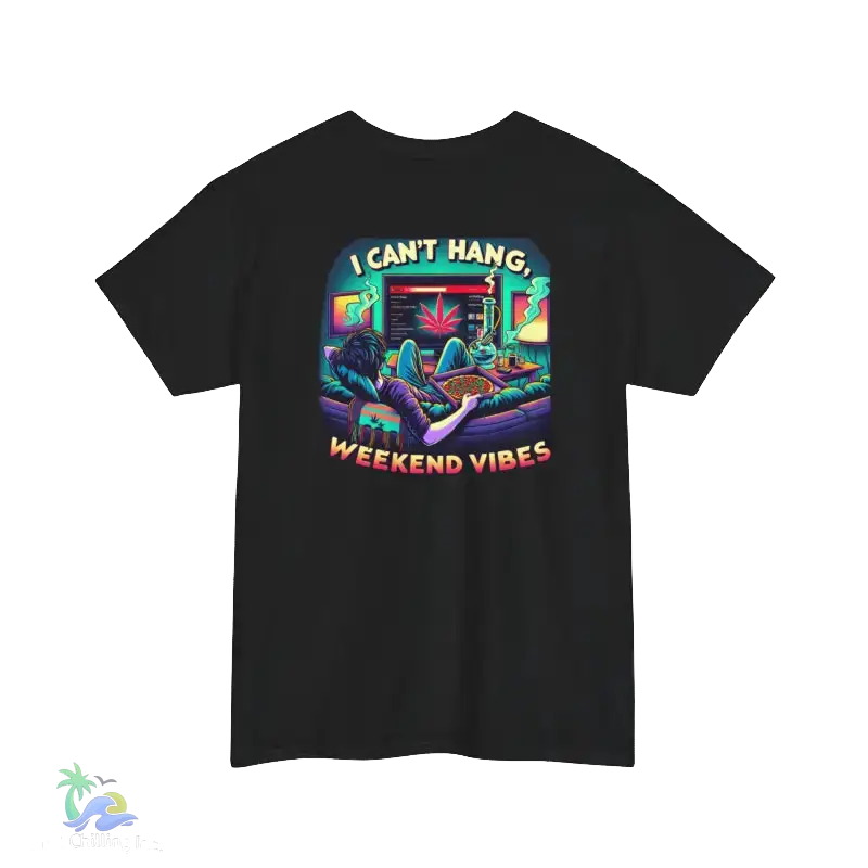 A black t-shirt with a colorful graphic design depicting a person lounging on a couch with a computer monitor in front of them, surrounded by various objects and text.