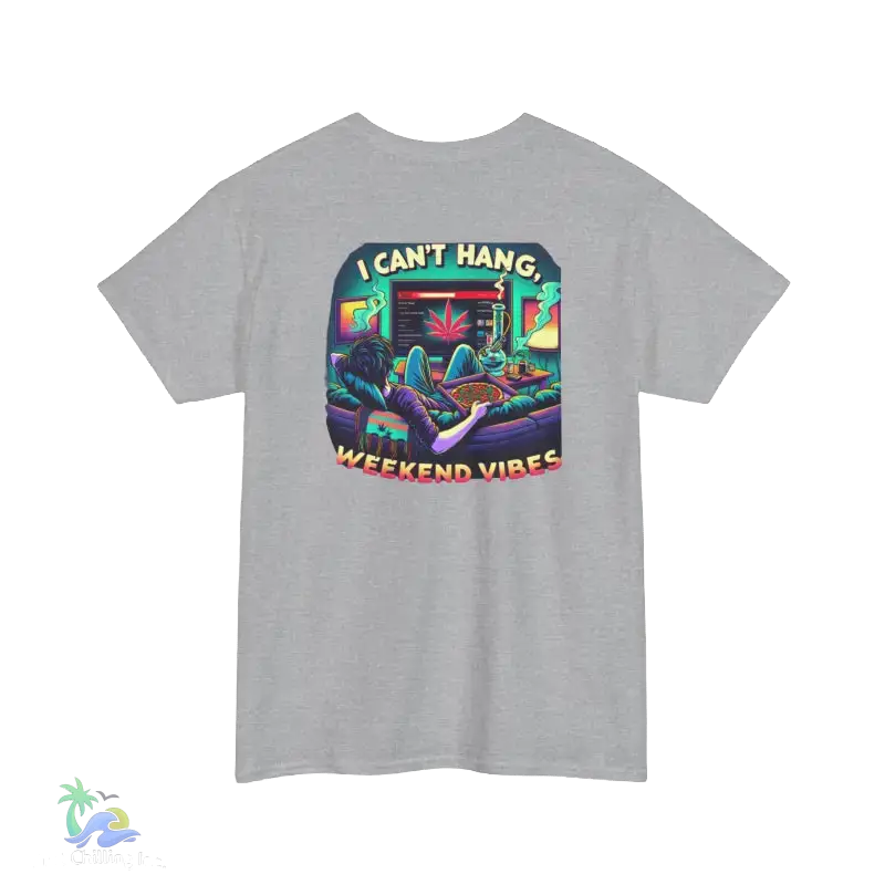 A gray t-shirt with a colorful graphic design depicting a person lounging in a chair with a computer monitor in front of them, surrounded by various objects and text.
