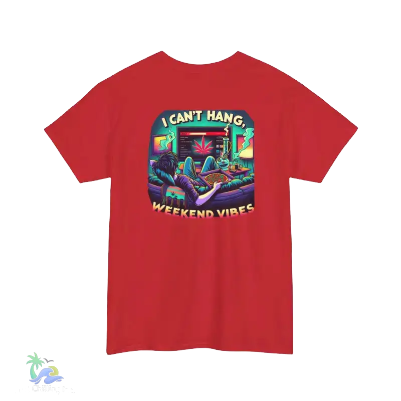 A red t-shirt with a colorful graphic design depicting a person lounging in a chair with a computer monitor in front of them, surrounded by various objects and text.