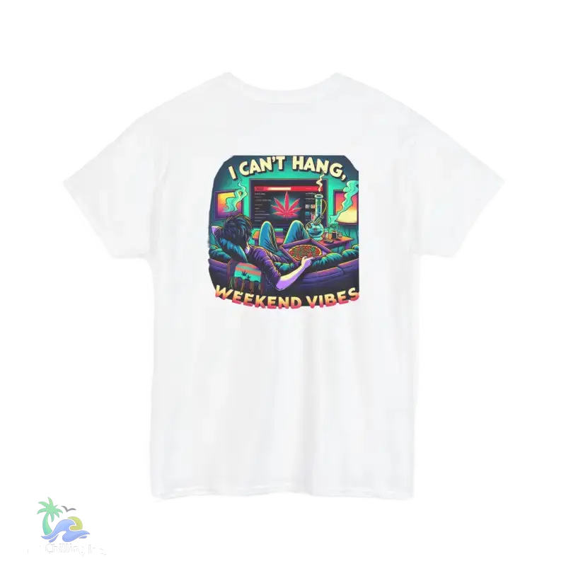 A white t-shirt with a colorful graphic design depicting a person lounging in a chair with a computer monitor in front of them, surrounded by various objects and text.