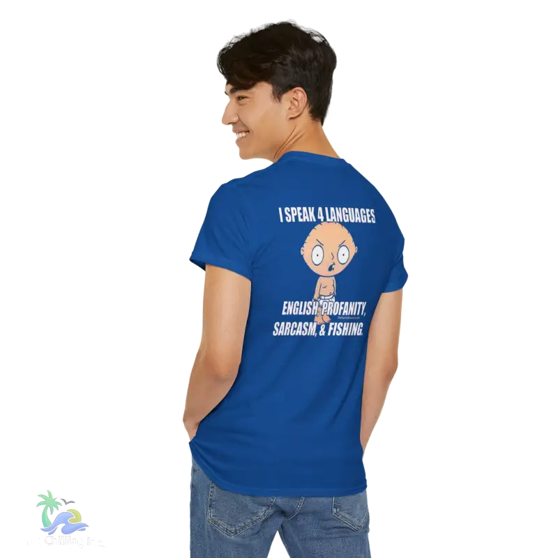 a man wearing a blue t - shirt with a cartoon character on it