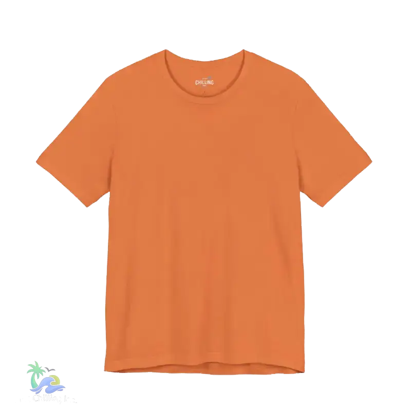 A plain, orange-colored t-shirt is shown against a black background.