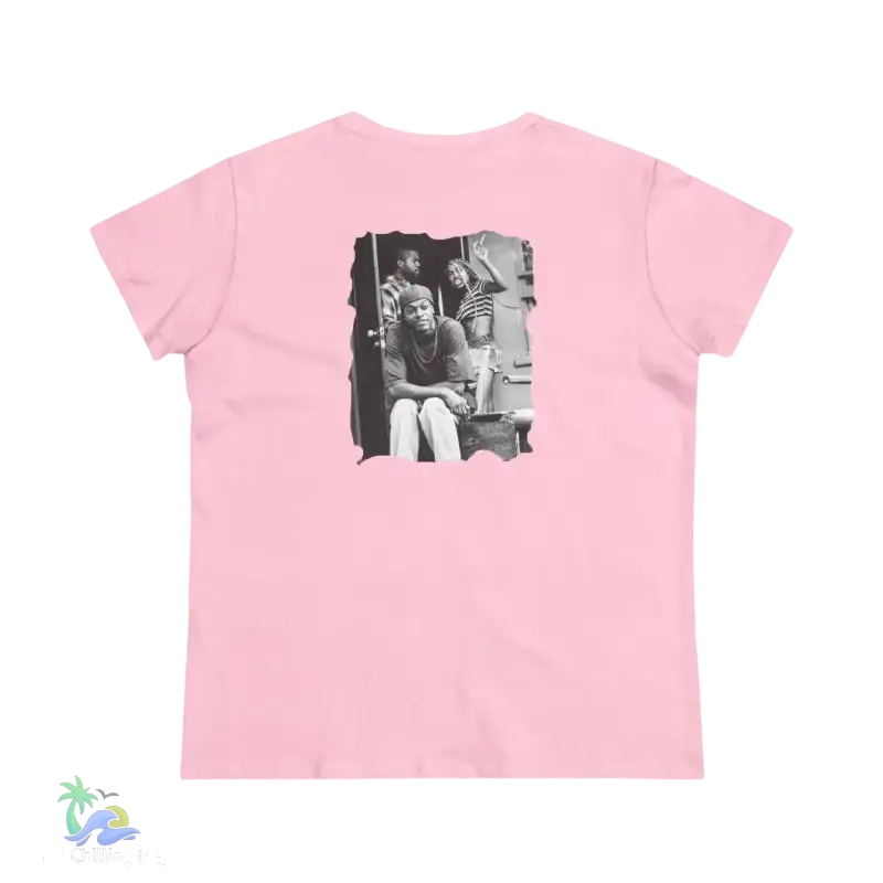 A pink t-shirt with a black and white photograph of three people on the back.