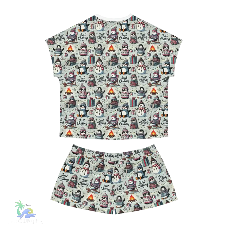 A t-shirt and shorts set featuring a repeating pattern of penguins and snowmen.