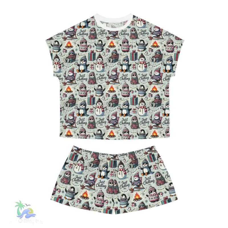 A t-shirt and shorts set featuring a repeating pattern of penguins and snowmen.