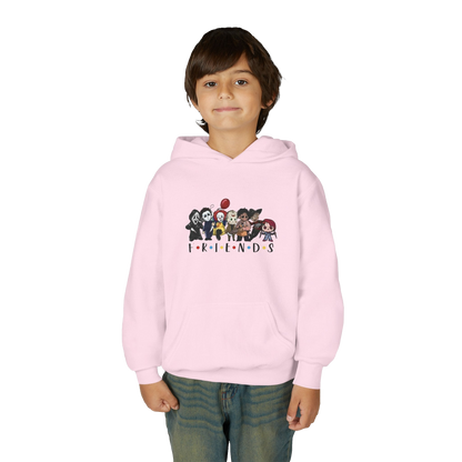 A young boy wearing a pink hoodie with a graphic of cartoon characters from the TV show Friends.