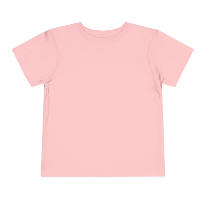 A simple, plain pink t-shirt against a black background.