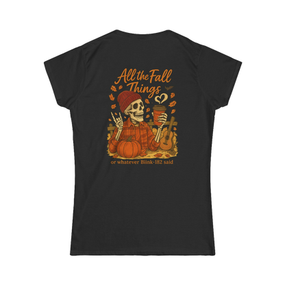 A black t-shirt with an illustration of a skeleton wearing a plaid shirt and holding a cup, surrounded by autumn-themed elements such as pumpkins and leaves. The text on the back of the t-shirt reads "All the Fall Things or whatever Blik 182 said".
