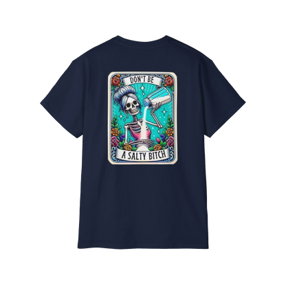 A dark blue t-shirt with a graphic design featuring a skeleton wearing a sombrero and holding a bottle of alcohol, surrounded by colorful flowers and text.