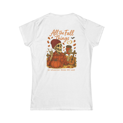 A white t-shirt with an illustration of a skeleton wearing a red hat and holding a cup, surrounded by autumn-themed elements such as pumpkins and leaves.
