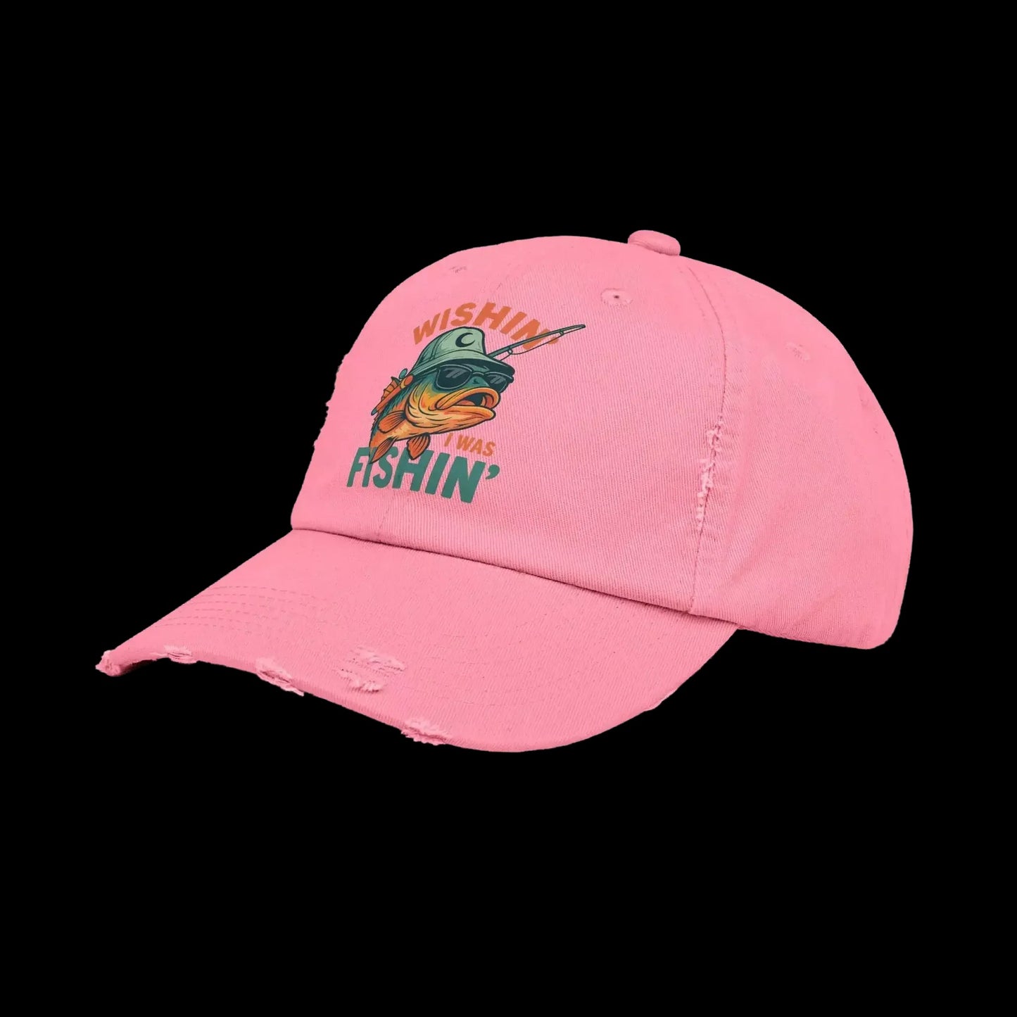 A pink baseball cap with a fish graphic and the text "WISHIN' I WAS FISHIN'" printed on it.