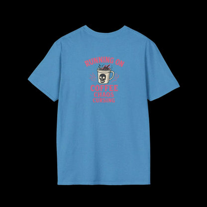 A blue t-shirt with a graphic design featuring a skull and mug with coffee, accompanied by the text "RUNNING ON COFFEE CAUSES CHAOS".