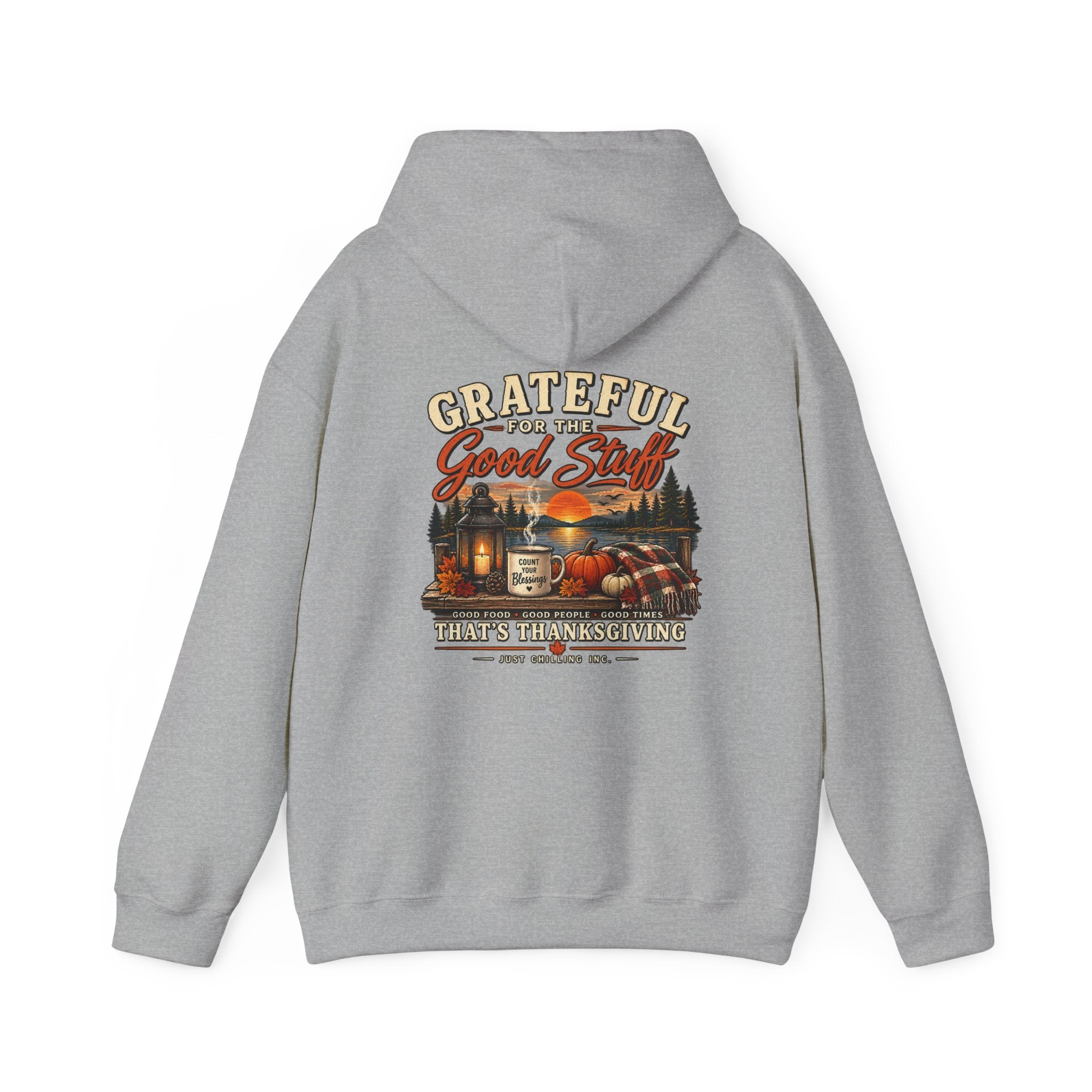 A light gray pullover hoodie shown from the back, featuring a large vintage-style graphic print with the text 'Grateful for the Good Stuff' and 'First Thanksgiving' above an illustration of a truck, cabin, and autumn landscape.