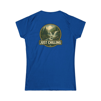 A blue t-shirt with a graphic design on the back, depicting a waterfall surrounded by trees and mountains. The text "JUST CHILLING" is displayed above the image.