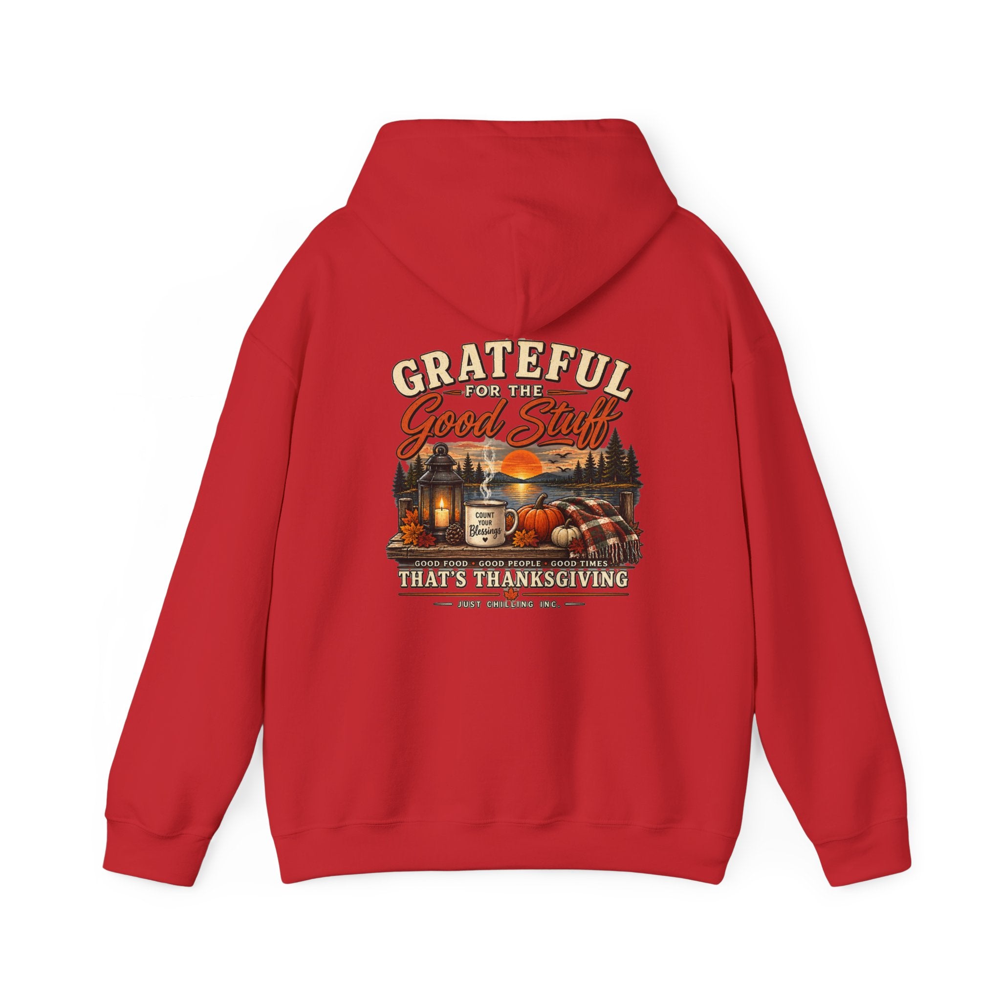 A red pullover hoodie shown from the back, featuring a large Thanksgiving-themed graphic print with the text 'Grateful for the Good Stuff That's Thanksgiving' and an illustration of a cabin, pumpkins, and autumn landscape.