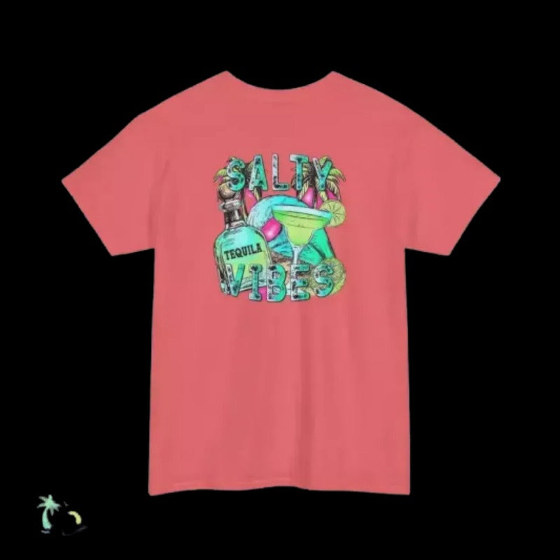 A bright pink t-shirt with a graphic design featuring a tequila bottle, a margarita glass, and the text "SALTY VIBES" in a colorful, stylized font.