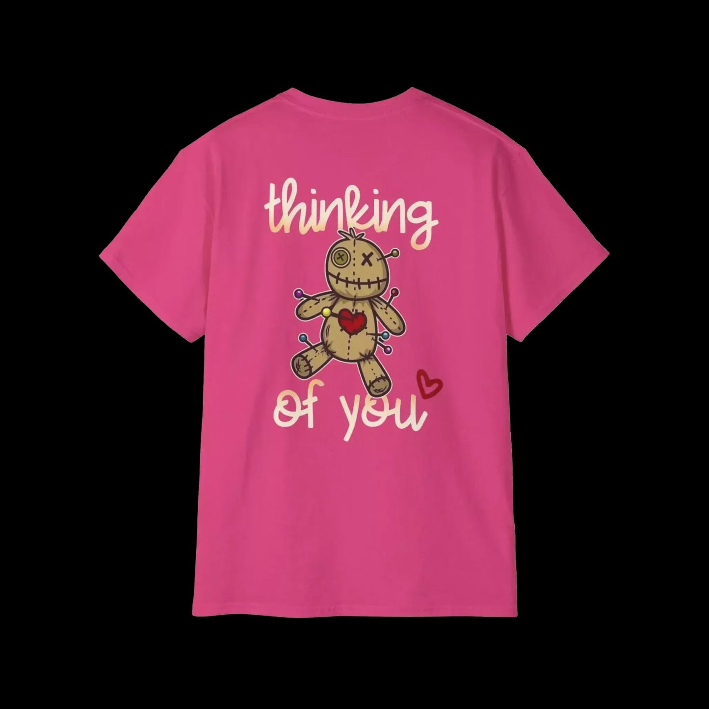 A pink t-shirt with a cartoon voodoo doll and the text "Thinking of you" printed on it.