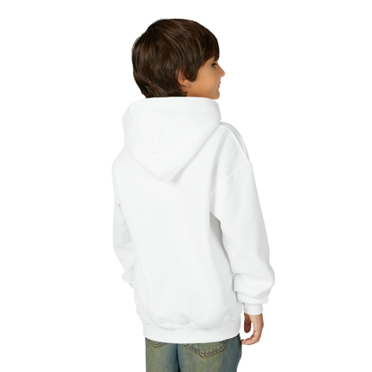 A young boy wearing a white hoodie stands against a black background, facing away from the camera.