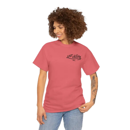A woman with curly hair wearing a red t-shirt with the text "JUST KILLING INC." printed on it.