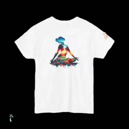 A white t-shirt with a colorful graphic design depicting a woman sitting in a meditative pose surrounded by a vibrant, abstract landscape.