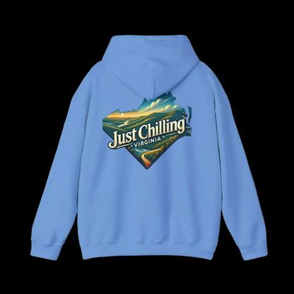 A light blue hoodie with a graphic design on the back, featuring a scenic landscape with mountains and a body of water.