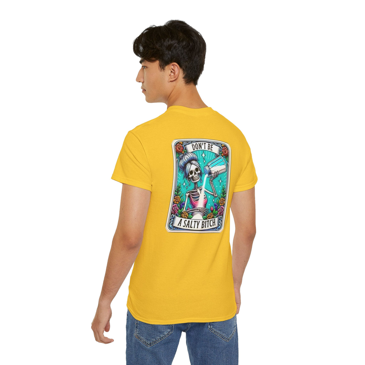 A person wearing a yellow t-shirt with a graphic design on the back.