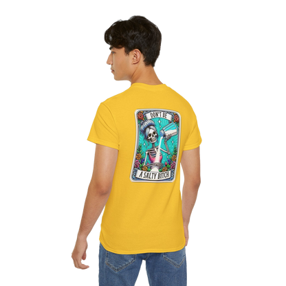A person wearing a yellow t-shirt with a graphic design on the back.