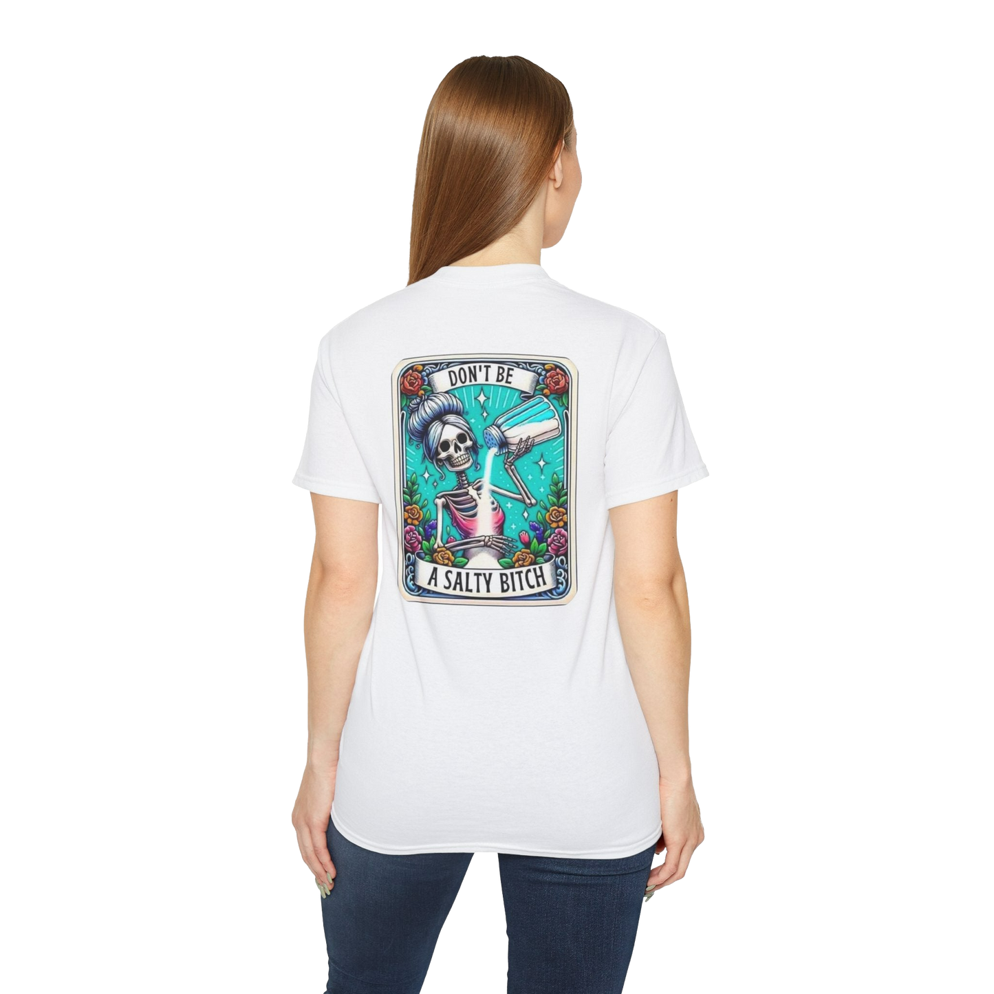 A woman wearing a white t-shirt with a graphic design on the back.