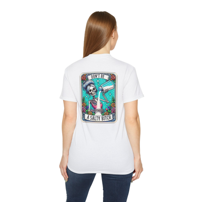 A woman wearing a white t-shirt with a graphic design on the back.