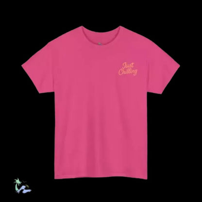 A bright pink t-shirt with the text "Just Chilling" printed on it.