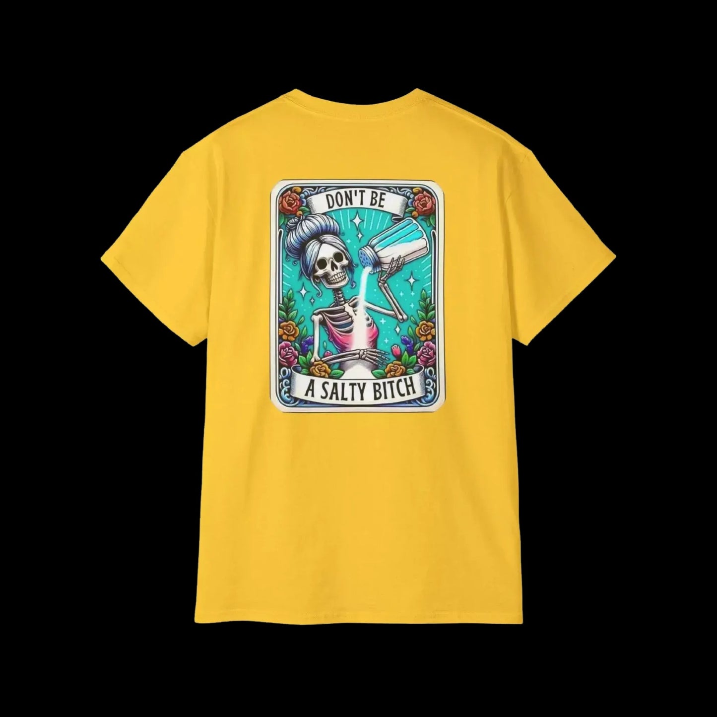 A yellow t-shirt with a graphic design featuring a skeleton wearing a sombrero and holding a bottle of alcohol, surrounded by colorful flowers and text.