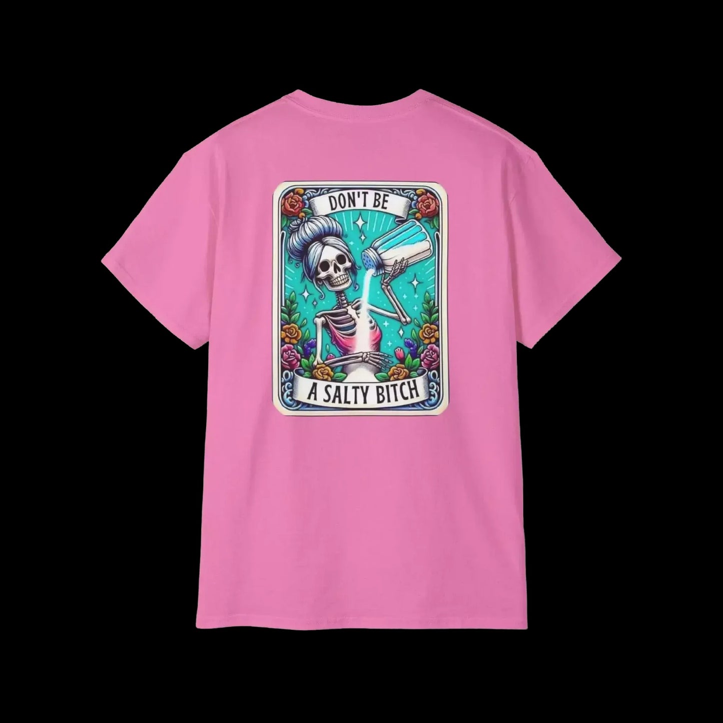 A pink t-shirt with a graphic design featuring a skeleton holding a bottle of alcohol and the text "DON'T BE A SALTY BITCH" against a colorful background.