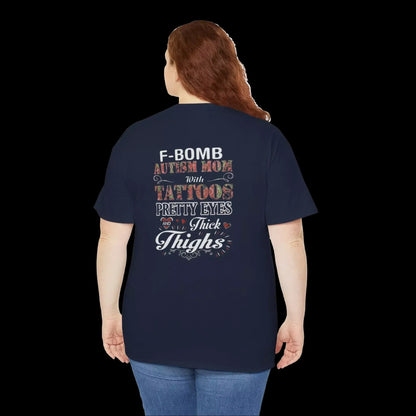 the back of a person wearing a navy blue t-shirt with text printed on it.